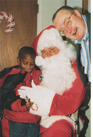 Lee Woodsworth with Santa and child